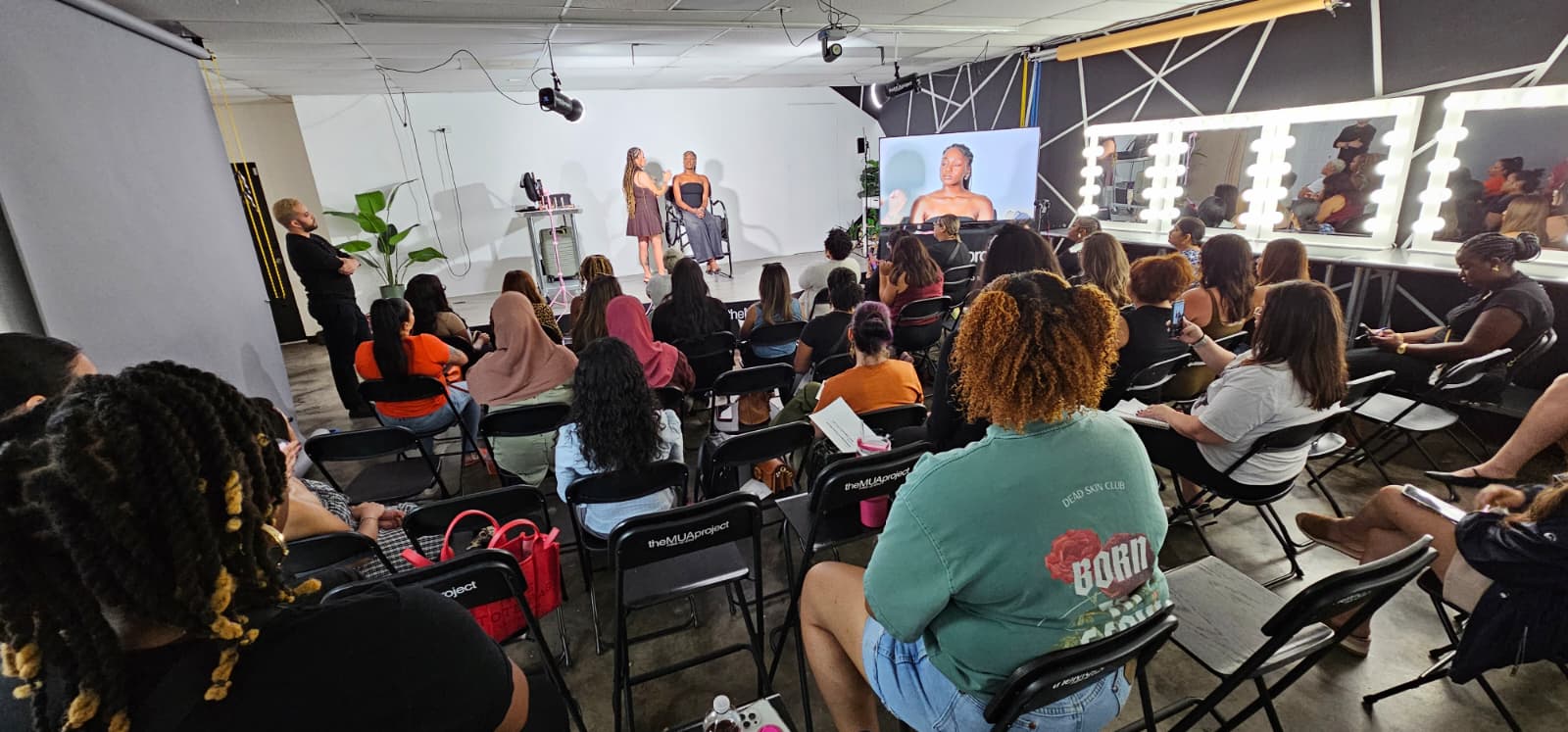 Audience attending a makeup class in a modern makeup classroom.